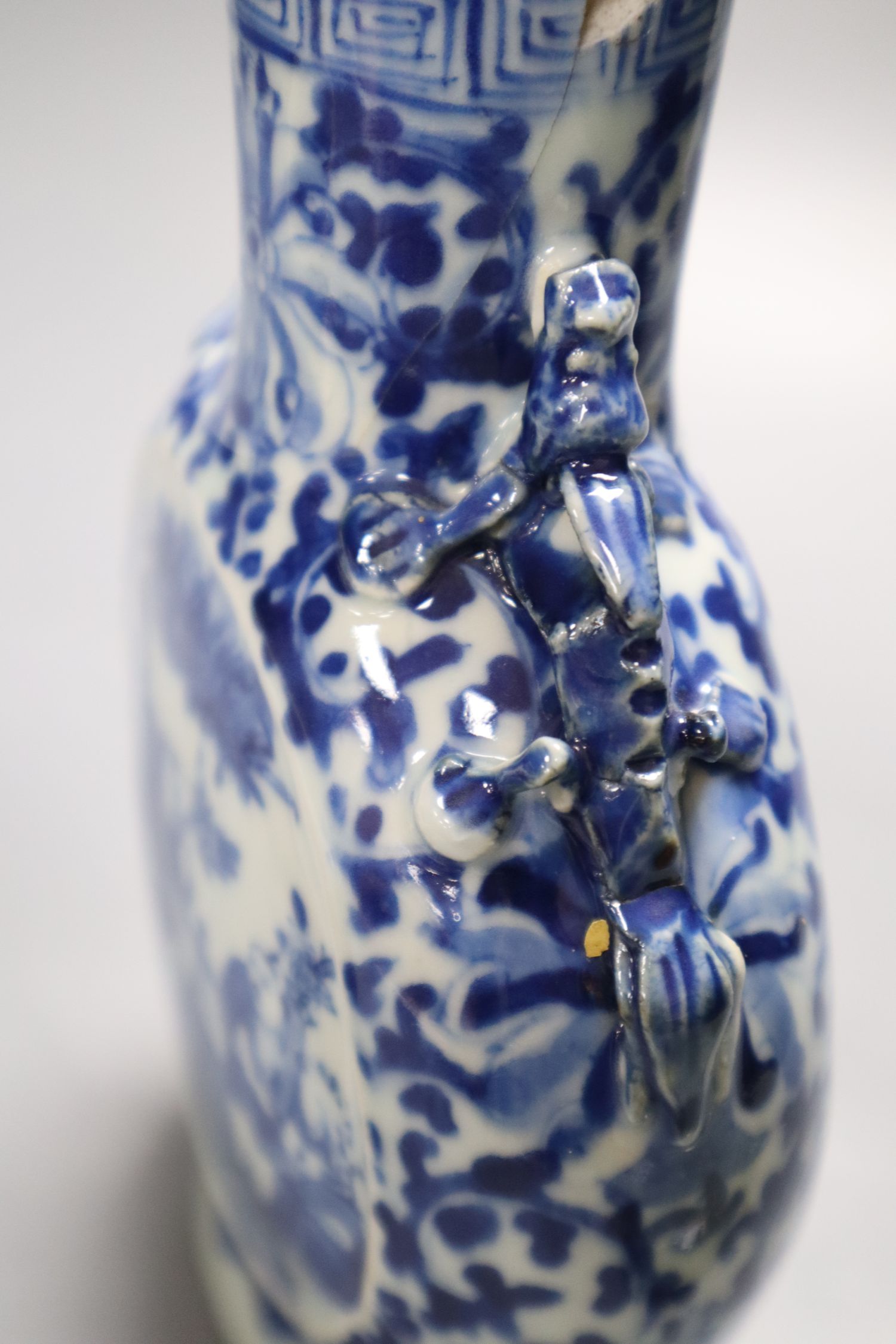 A Chinese blue and white moon flask, a Chinese celadon glazed moon flask and a famille verte baluster vase, tallest 21cm